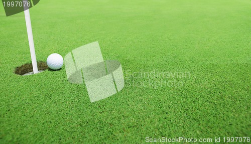 Image of Golf ball near the hole