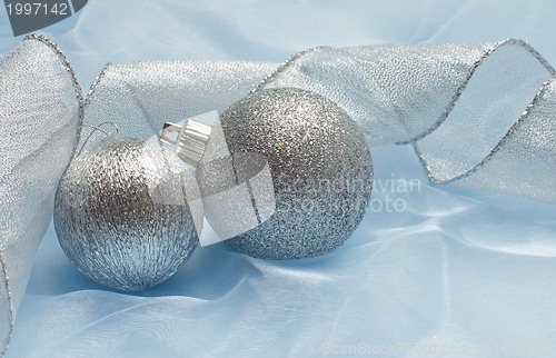 Image of christmas ball on blue silk