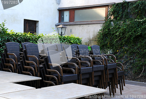 Image of Stack of Chairs in the Courtyard Restaurant