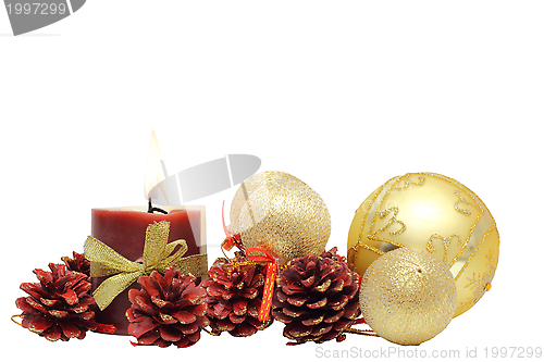 Image of bunch of christmas decoration and candle