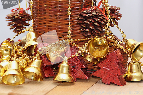 Image of gold bells and christmas tree shaped candles