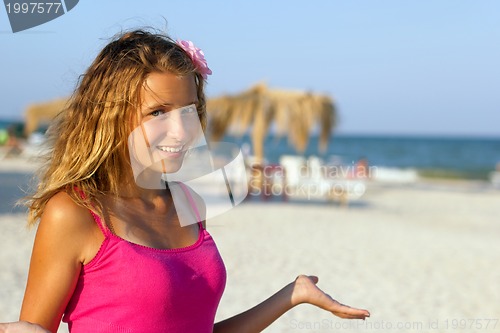 Image of happy teen girl on the beach
