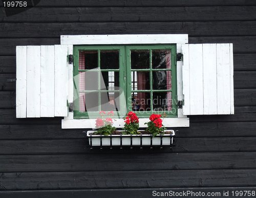 Image of Decorative window of wooden cabin