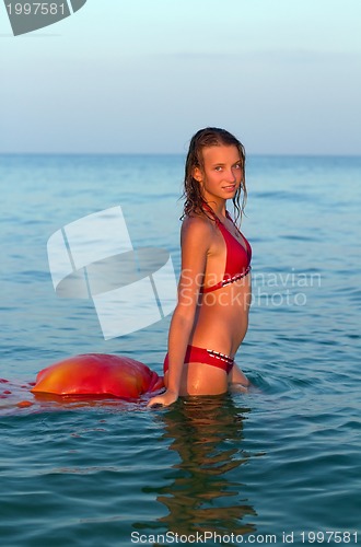 Image of attractive teen girl in the sea