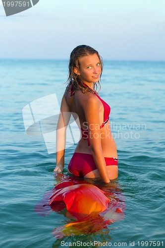 Image of smiling teen girl in the sea