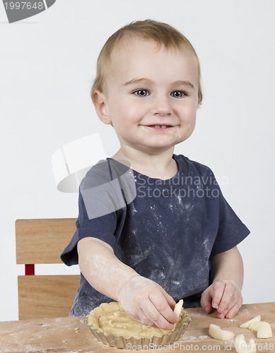 Image of child making cookies