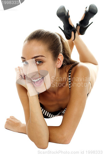Image of Excited female bikini model with cheeky expression
