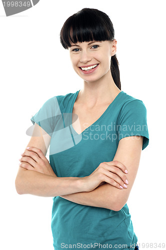 Image of Pretty woman posing with her arms crossed