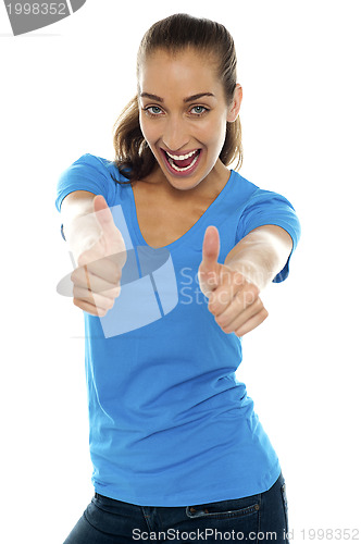 Image of Overjoyed woman showing double thumbs up