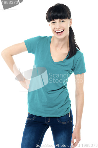 Image of Trendy lady posing in style and flashing a smile