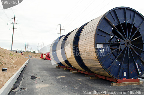 Image of high voltage cable reels and road construction 