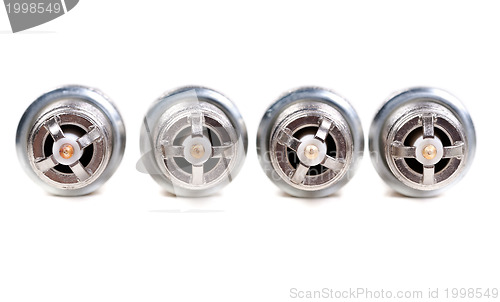 Image of Four automobile spark plugs