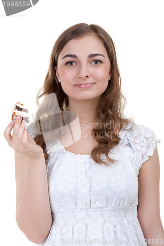 Image of young woman eating the cake