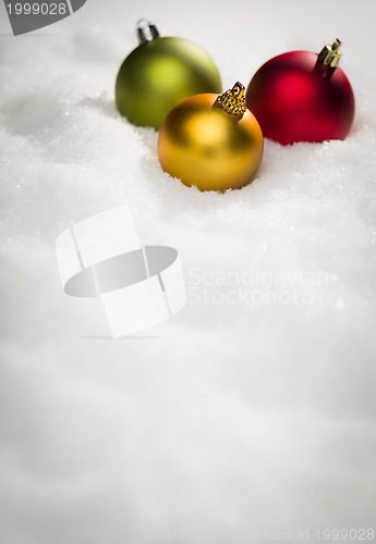 Image of Christmas Ornaments on Snow Flakes with Text Room