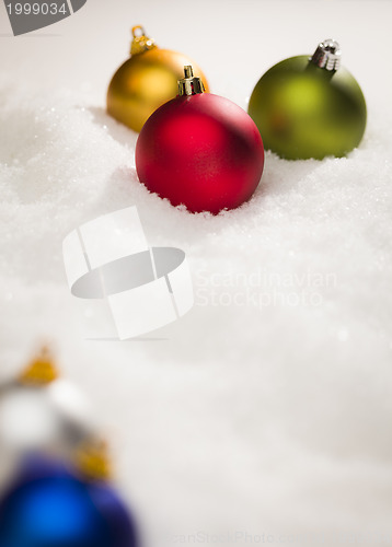 Image of Christmas Ornaments on Snow Flakes with Text Room