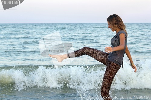 Image of girl having fun in the sea