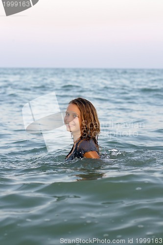 Image of smiling teen girl in the sea