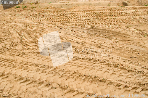 Image of truck car tracks near sand pit construction 