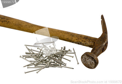 Image of retro rusty hammer nails pile isolated 