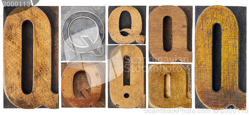 Image of letter Q in wood type blocks