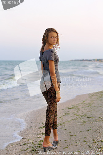 Image of Beautiful girl in a wet dress