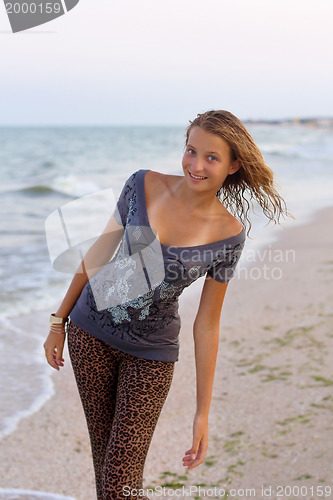 Image of smiling girl in wet clothes