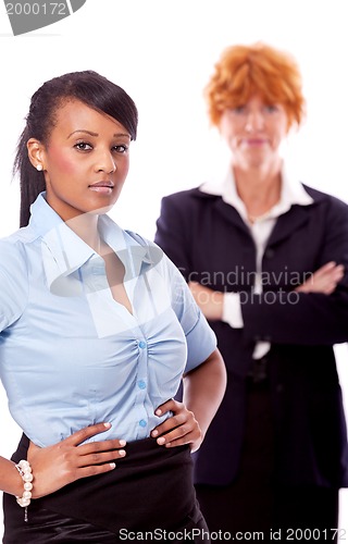 Image of young african business woman with redhead adult woman