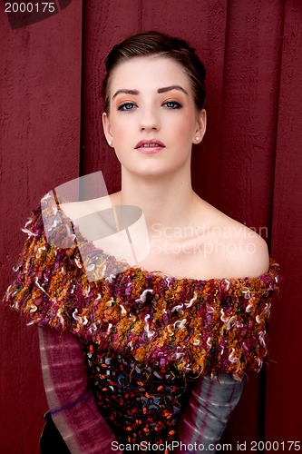 Image of beautiful brunette woman on red background