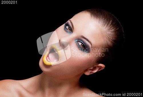 Image of woman with extreme colorfull make up in blue and yellow