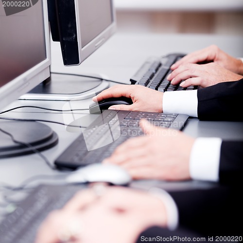 Image of male hand on keyboard typing and scroll mouse