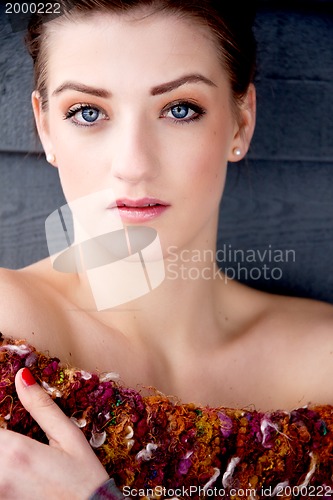 Image of portrait brunette woman with blue eyes