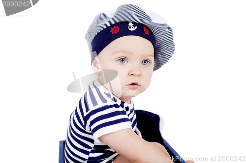 Image of cute little baby in sailor fashion playing 