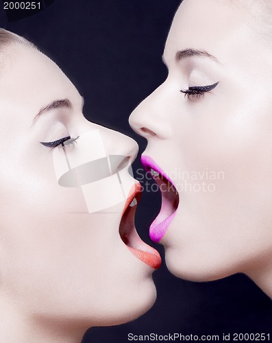 Image of two beautiful faces with open mouth and lipstick