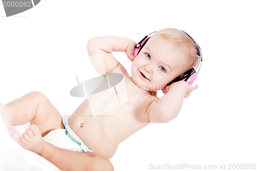 Image of cute little baby with protection earphones 