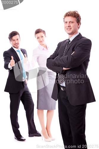 Image of young successful business man in front a group