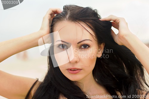 Image of young woman on the beach