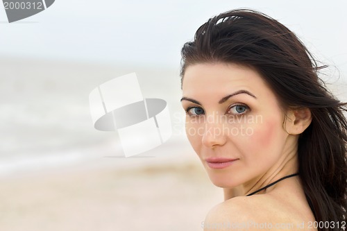 Image of pretty young woman on the beach