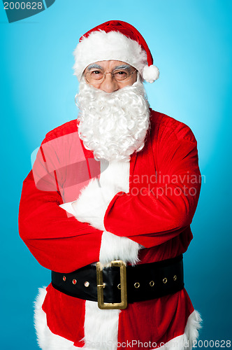 Image of Confident aged male in Santa costume