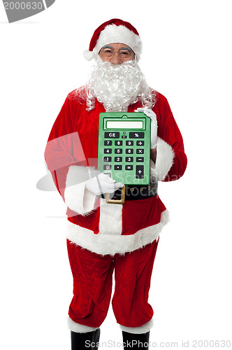 Image of Old man dressed as Santa showing a large green calculator