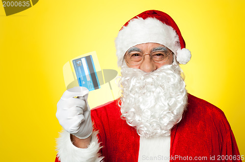 Image of Aged man in Santa clothing ready to shop