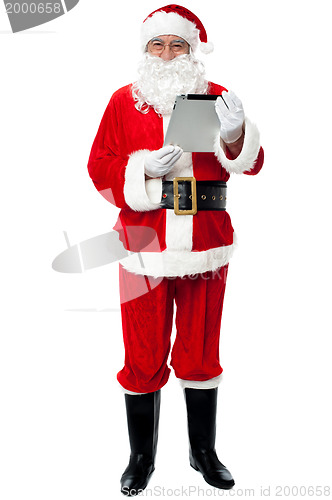 Image of Father Christmas using new tablet device