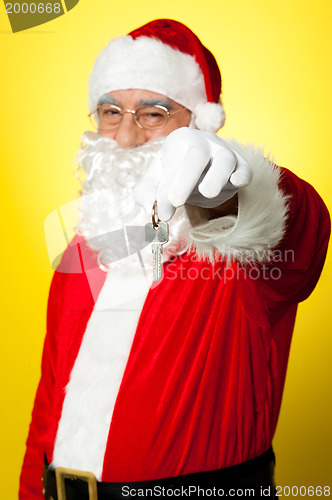 Image of Aged Santa dangling a key