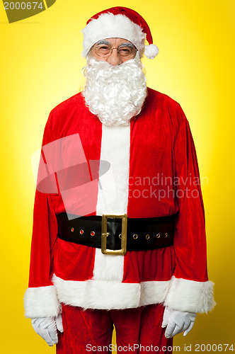 Image of Isolated aged male dresses in Santa attire