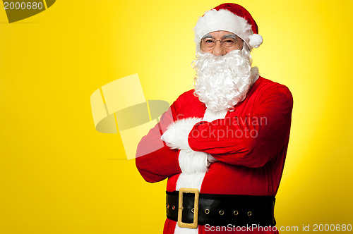 Image of Saint Nick posing confidently against yellow background