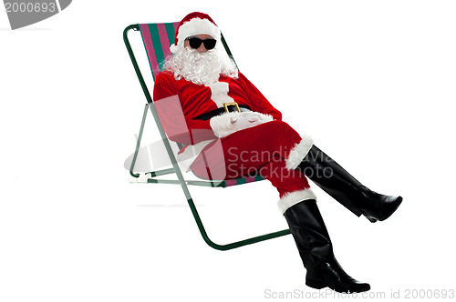 Image of Santa wearing shades and striking stylish pose