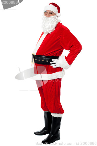 Image of Confident Santa with a big belly posing sideways