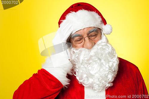 Image of Portrait of Santa Claus suffering from headache