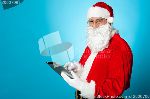 Image of Santa using newly launched electronic tablet device