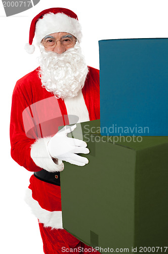 Image of Photo of kind Santa Claus giving xmas presents