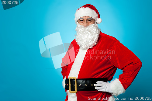 Image of Aged Santa posing with hands on his waist